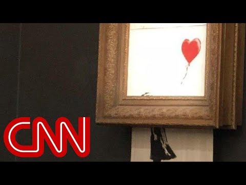 Watch Banksy&#039;s $1.4 million painting &#039;self-destruct&#039;