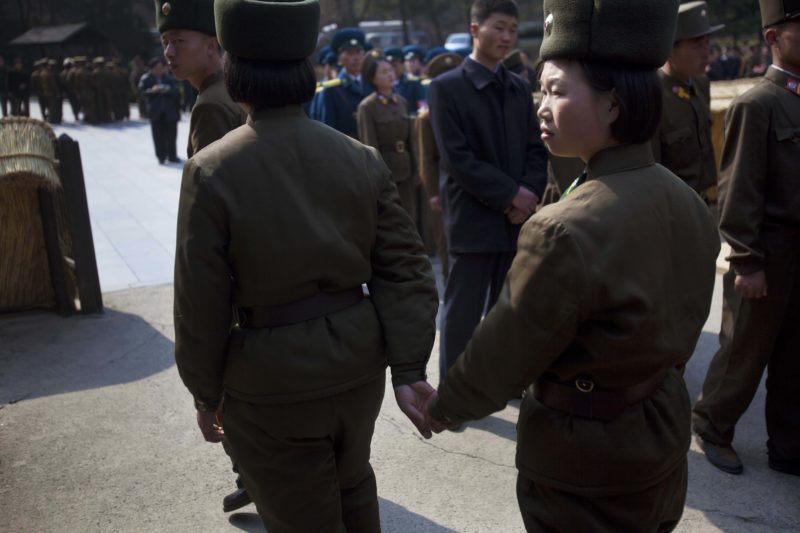 David Guttenfelder – Two female North Korean soldiers hold hands as they tour the birthplace of Kim Il Sung at Mangyongdae, North Korea