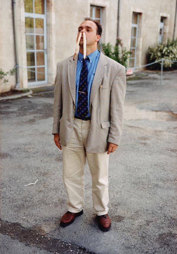 Erwin Wurm - One Minute Sculpture, The bank manager in front of his bank, 1999