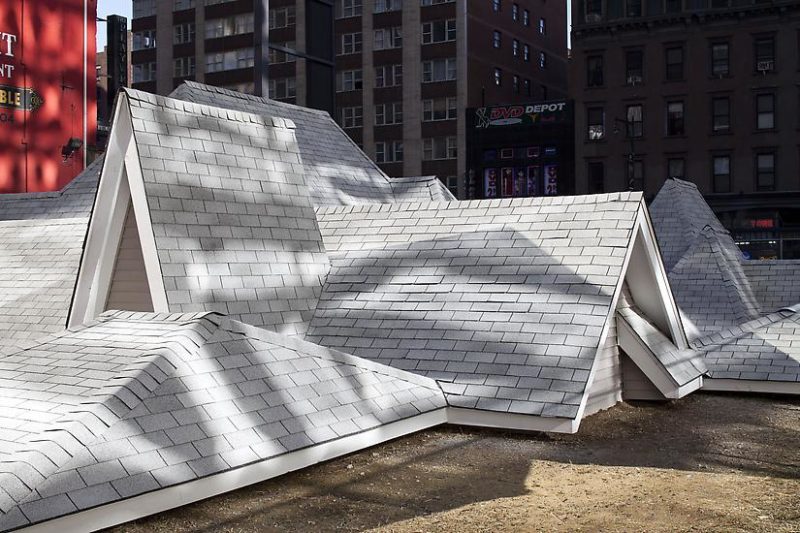 David Brooks - Desert Rooftops, 2011–12, asphalt shingled rooftops, wood, vinyl siding, metal interpretive signs, 16 x 92 x 54 feet, Times Square, New York, November 2011–February 2012