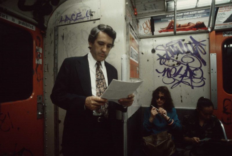 Christopher Morris - A commuter reading, 1981