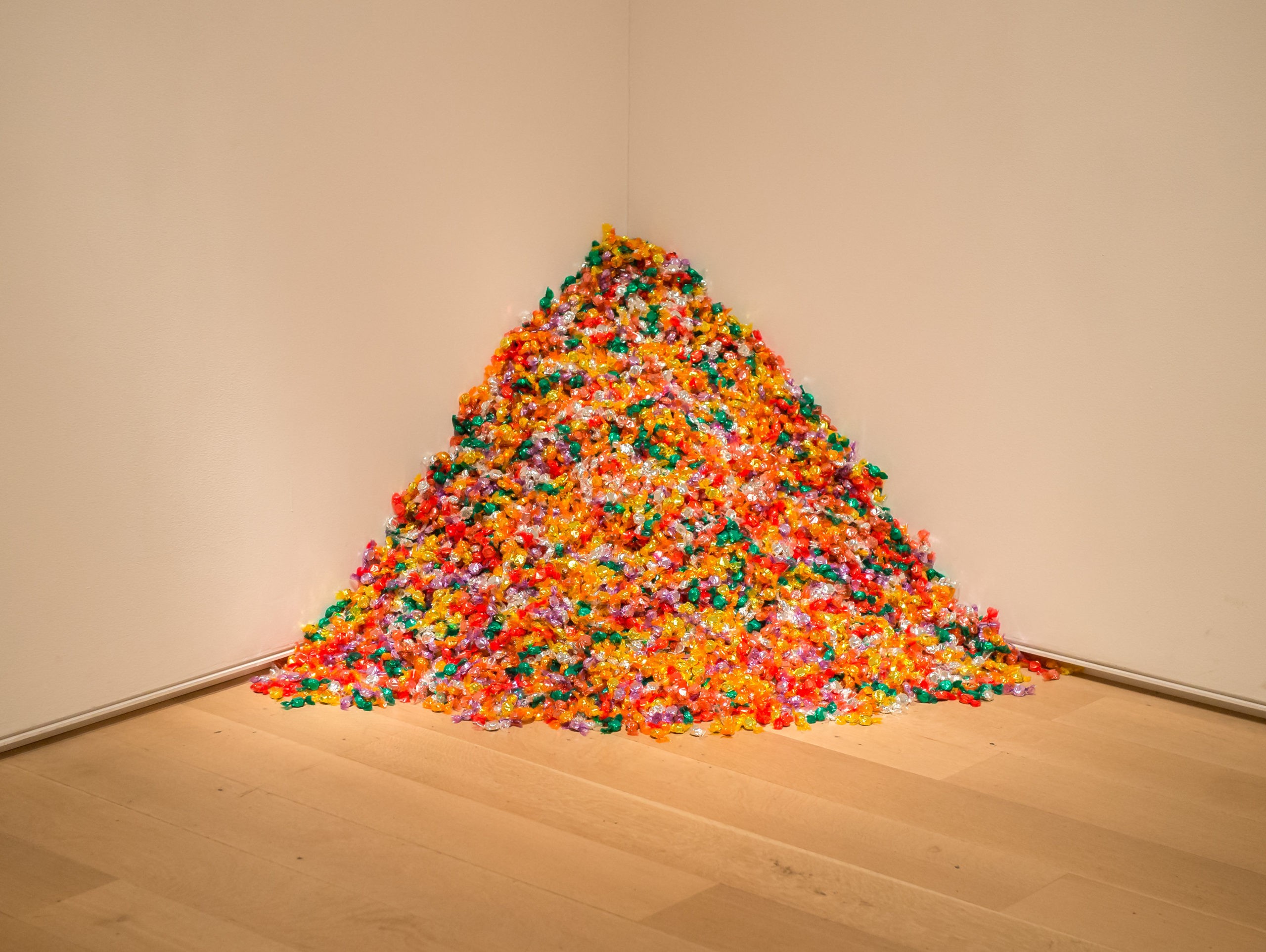 Why did Félix González-Torres put free candy in a museum?