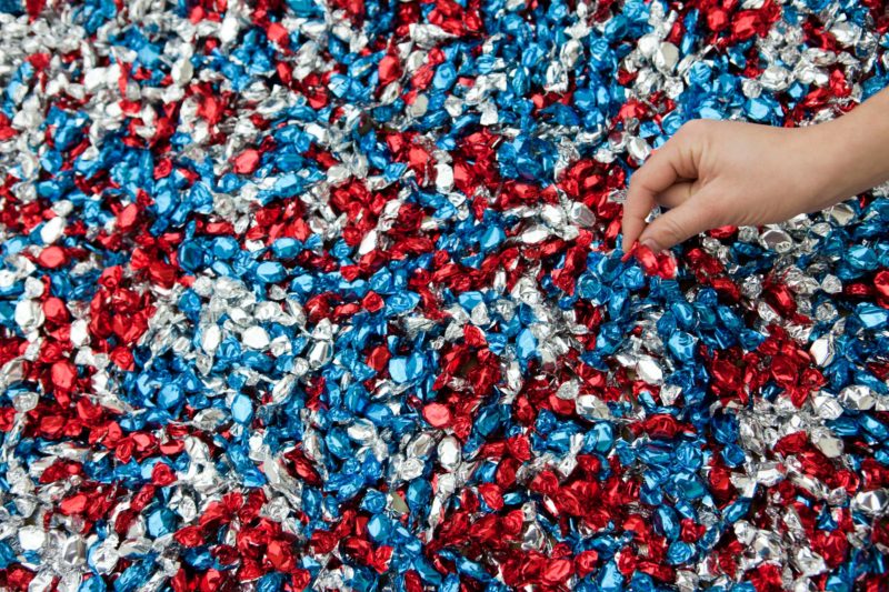 Félix González-Torres – Untitled (USA Today), 1990, Candies, individually wrapped in red, silver, and blue cellophane (endless supply), Dimensions vary with installation Ideal weight 300 lbs (136 kg)