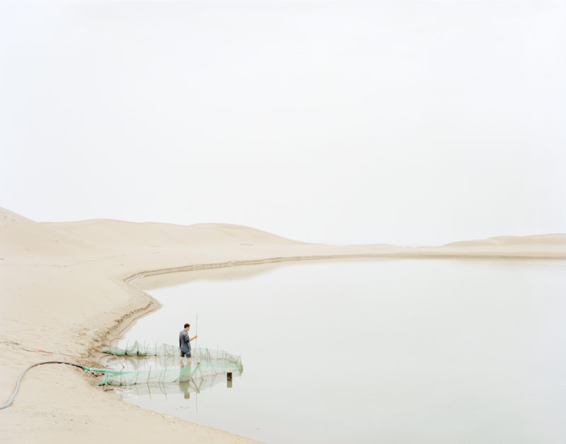 Zhang Kechun - Man Pumping Water in Wasteland, Ningxia Province, 2011