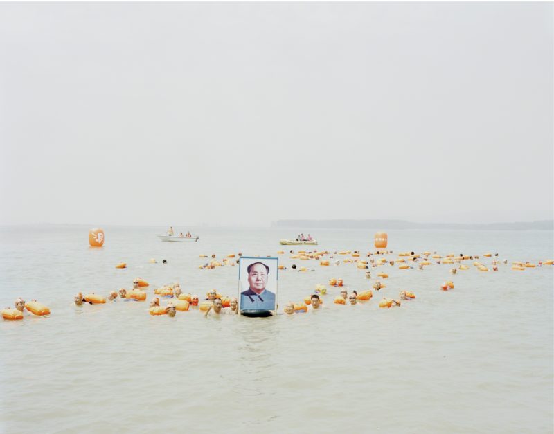 Zhang Kechun - People Crossing the Yellow River with a Photo of Mao Zedong, Henan, 2012