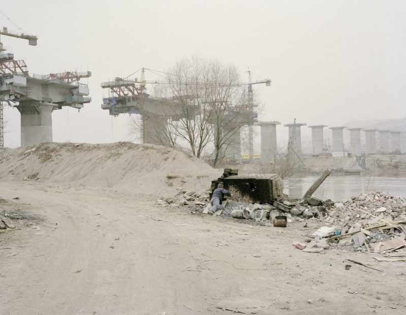 Zhang Kechun - Workers Taking Midday Rest beside a Bridge, Gansu, 2010