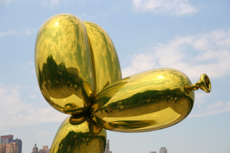 Jeff Koons - Balloon Dog (Yellow), 1994–2000, high chromium stainless steel, transparent color coating, installation view, roof of Metropolitan Museum of Art, New York City, USA, 2008