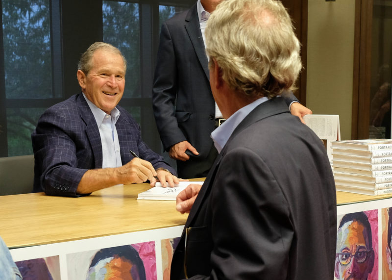 President Bush participates in a Portraits of Courage book signing at the George W. Bush Presidential Center