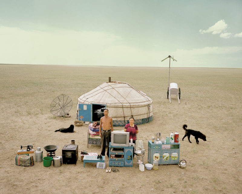 Huang Qingjun – Family Stuff, Mongolian Batu Aoqier and his wife, AoYong Qimuge, are standing in front of their yurt, Inner Mongolia, 2007