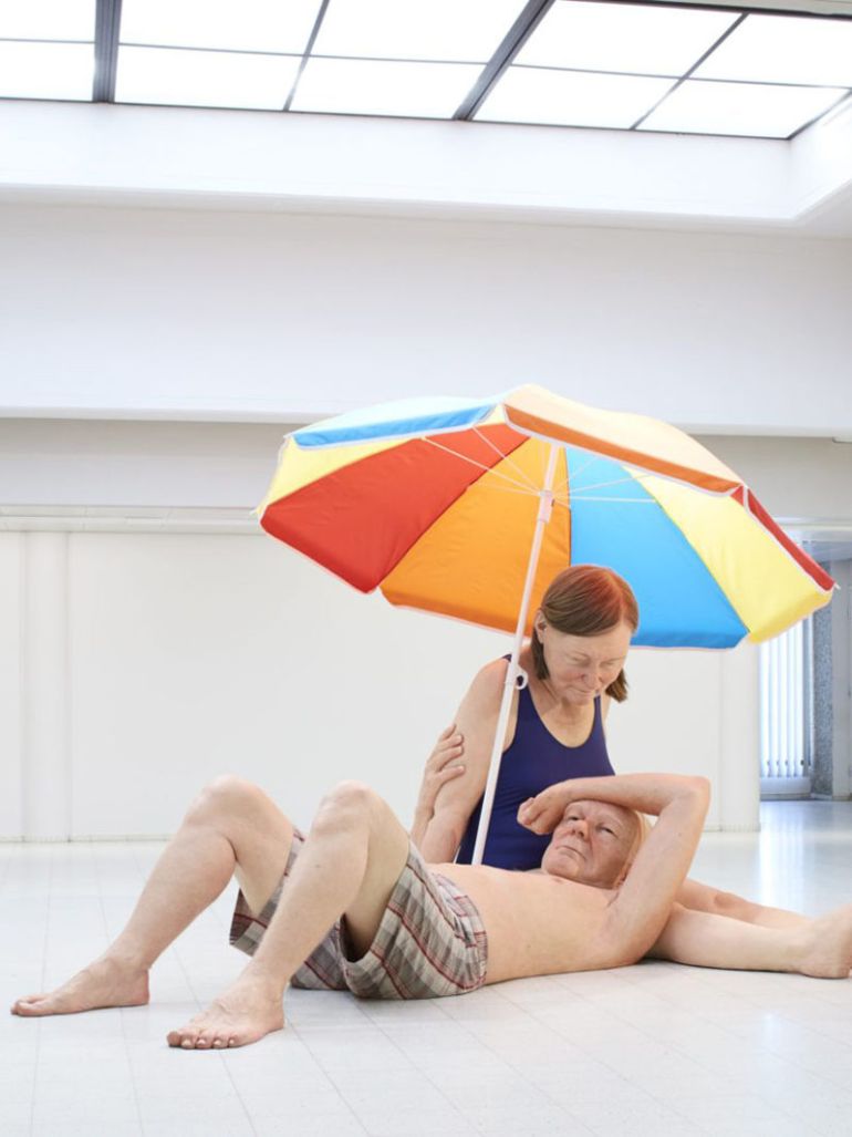 Ron Mueck's Couple Under An Umbrella sculpture tells the story of love