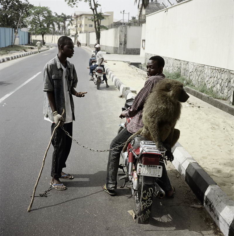 Pieter Hugo - Handler with School Boy, Lagos, Nigeria 2007