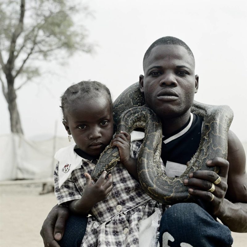Pieter Hugo - Mummy Ahmadu and a snake charmer with a rock python, Abuja, Nigeria 2005