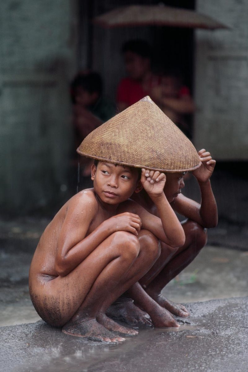 Steve McCurry - Kids under a caping, Indonesia from Right as Rain