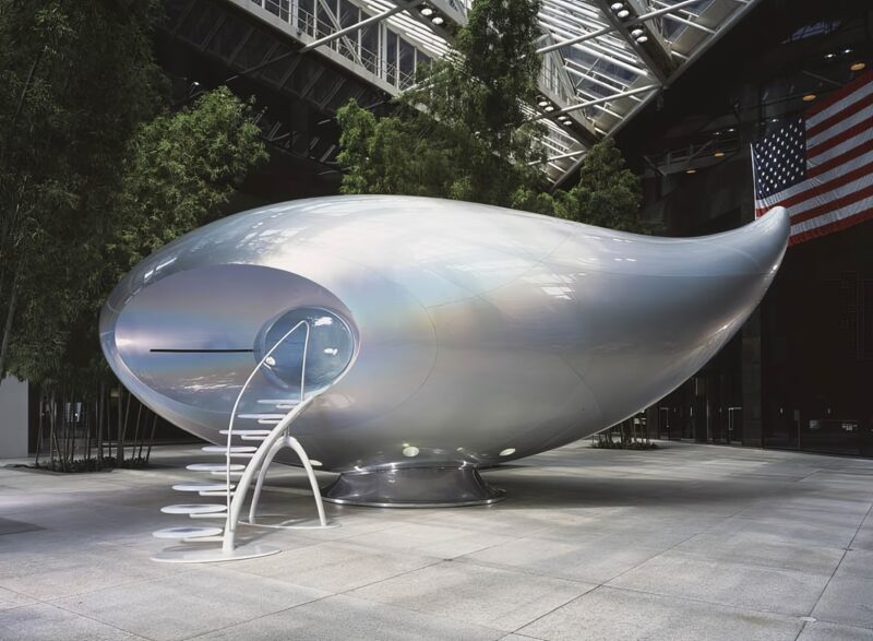 Mariko Mori – Wave UFO, 1999-2002, brainwave interface, vision dome, projector, computer system, fiberglass, 207 x 446 x 194 inches (528 x 113.4 x 493 cm), glass atrium of 590 Madison Avenue, New York, 2003