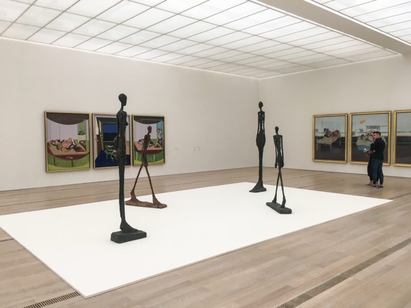 Installation view of Bacon - Giacometti at Fondation Beyeler, L Homme qui marche by Alberto Giacometti along other works 1