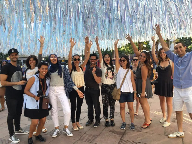 Students with Poetic Kinetics' Liquid Shard, 2016, holographic Mylar, monofilaments, approx. 15,000 square feet.