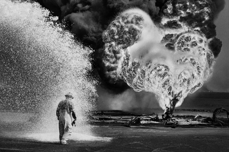 Sebastião Salgado – Greater Burhan Oil Field, Kuwait, 1991 Chemical spray protects firefighter