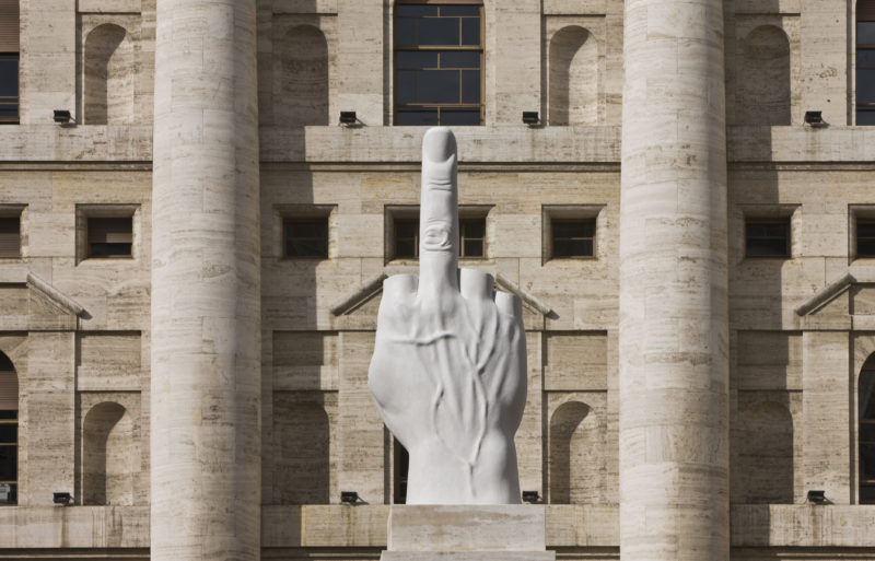 Maurizio Cattelan - L.O.V.E., 2010, White Carrara Marble, roman travertine, 1100 x 470 x 470 cm (36.1 x 15.5 x 15.5 feet), Piazza Affari Milano, Italy