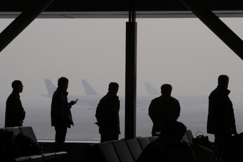 Lu Guang - Severe haze occurred in Capital International Airport. Passengers are waiting in the airport lounge