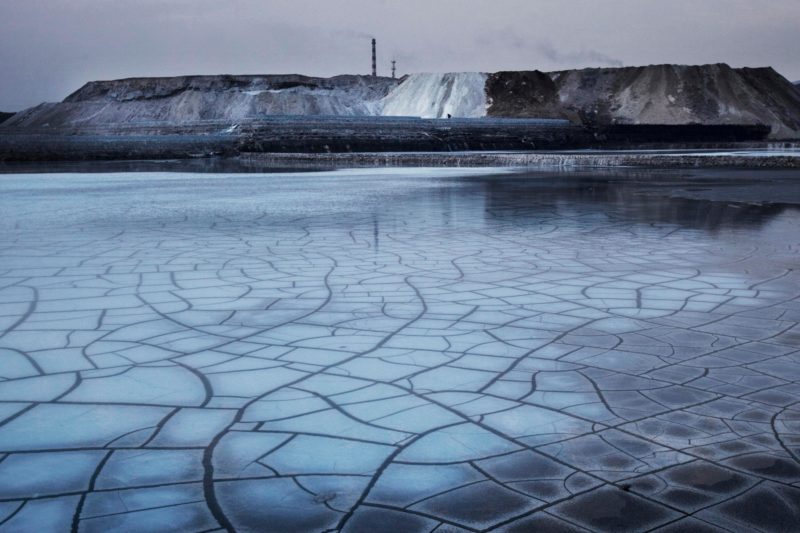 Lu Guang - Wuhai Chemical Plant produces PVC products that create lots of poisonous waste material and sewage, which gets dumped along the coast of the Yellow River