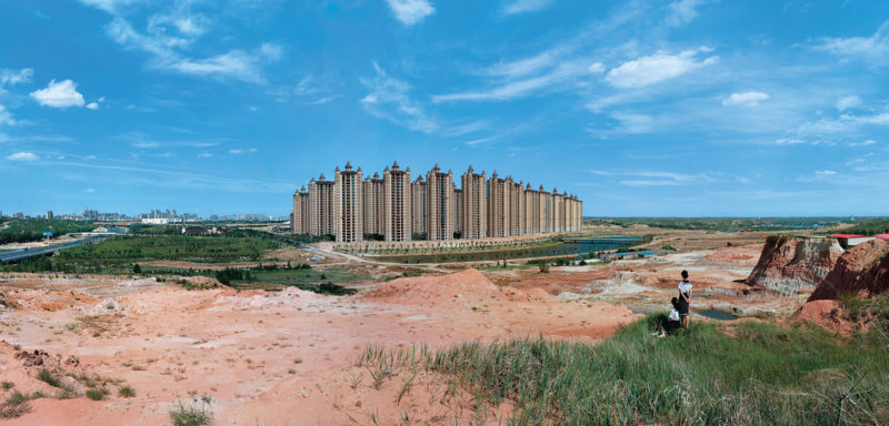 Weng Fen - Staring at Ordos, Series of three photographs, 2014, Two schoolgirls gazing out to Kangbashi New Area, formerly farmland and now the showpiece district of Ordos City, in China