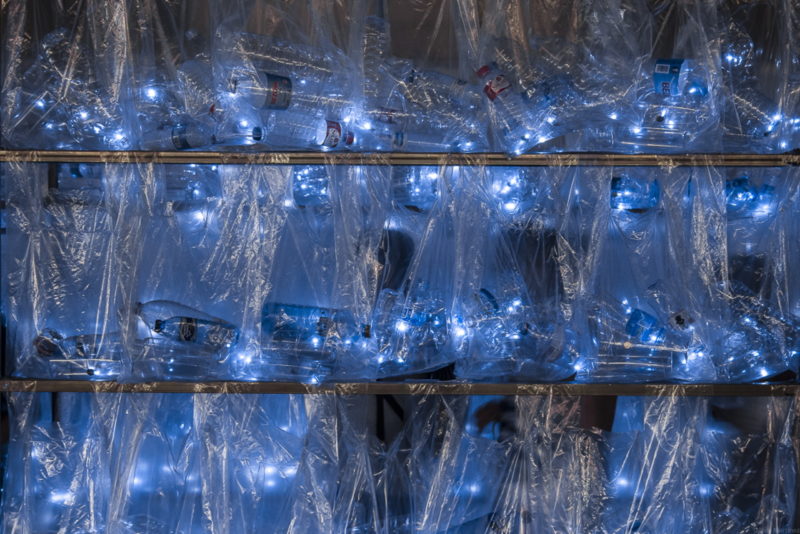 erruptus - Labyrinth of plastic waste, 2017, 15000 discarded water bottles, bags, metal, lights, 300 m2, 3m tall walls, Plaza Mayor, Madrid, Spain