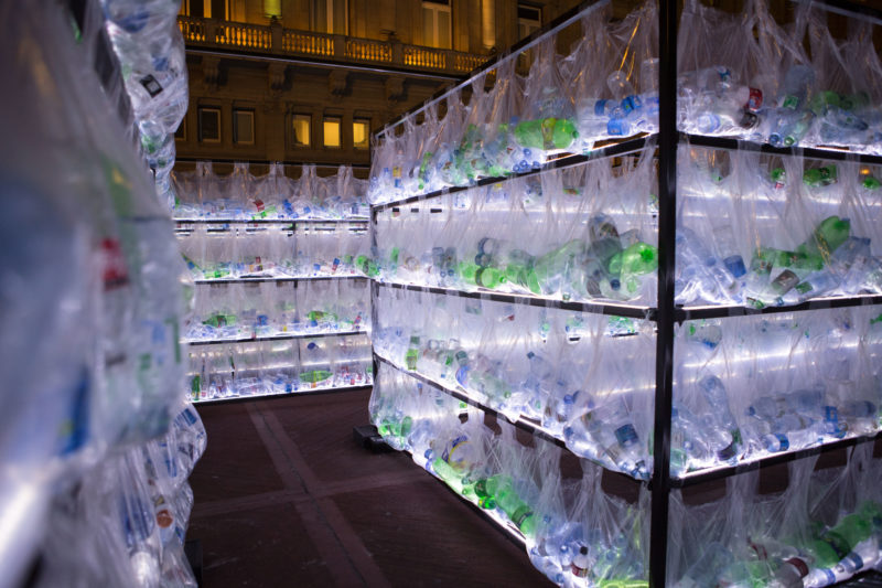 Luzinterruptus - Labyrinth of plastic waste, 2018, 15000 discarded water bottles, bags, metal, lights, 12 x 12 m, Plaza Vaticano, Buenos Aires, Argentina