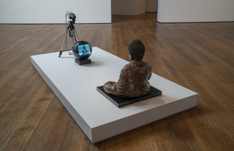Nam June Paik - TV Buddha (Bronze Seated Buddha), 2004, Video installation with closed circuit camera, black and white JVC television, and bronze Buddha statue with permanent oil marker, 55 × 50.8 × 40.6 cm (21 11/16 × 20 × 16 in.)