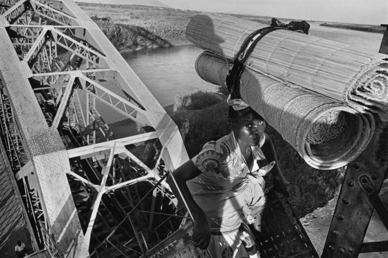 Sebastião Salgado - A woman after a break in the transit city Mutarara on the way to Maputo, 1994