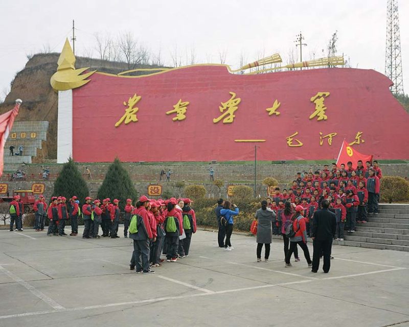 Shi Yangkun - Students visit the square at the entrance to Dazhai Village, Shanxi province, 2018