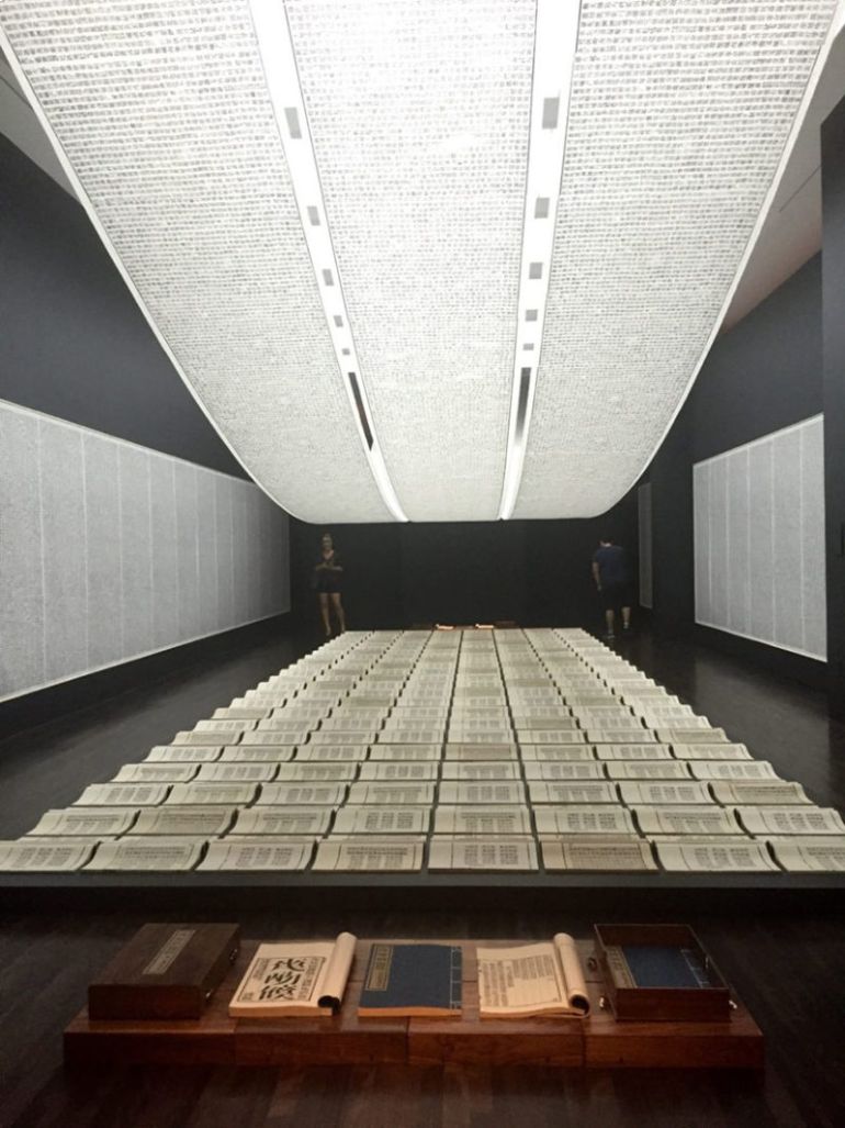 Xu-Bing-Book-from-the-Sky-1987-1991-installation-of-hand-printed-books-and-ceiling-and-wall-scrolls-printed-from-wood-letterpress-type-ink-on-paper-Blanton-Museum-of-Art-feat