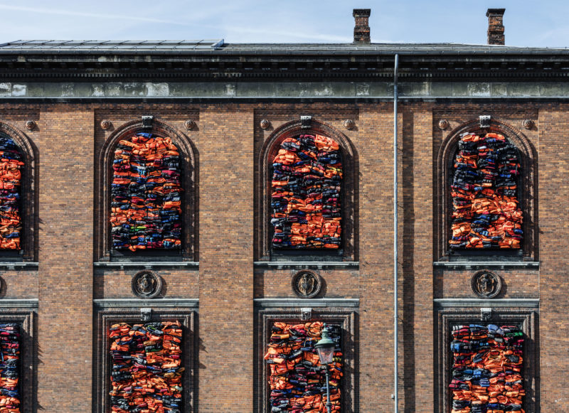 Ai Weiwei - Soleil Levant, 2017, life jackets in front of windows of facade, Kunsthal Charlottenborg, 2017, Anders Sune Berg.