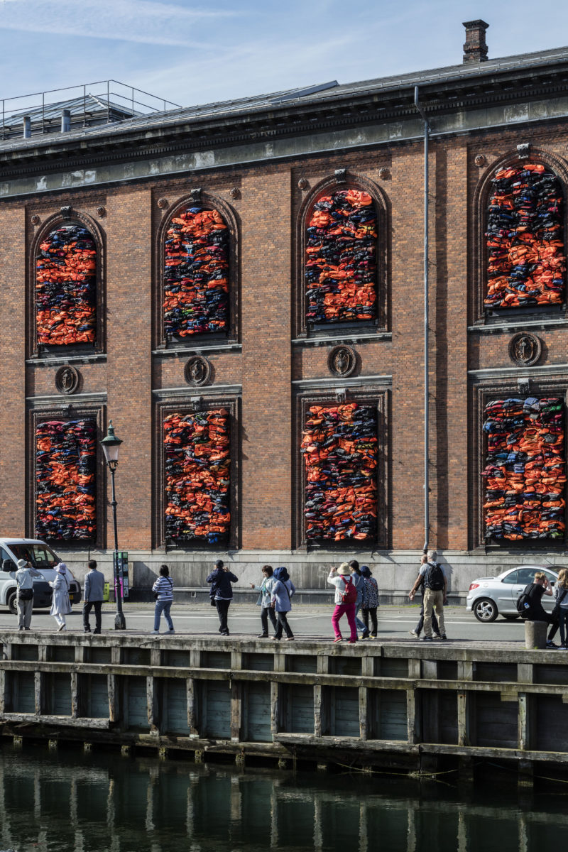 Ai Weiwei - Soleil Levant, 2017, life jackets in front of windows of facade, Kunsthal Charlottenborg, 2017, Anders Sune Berg.