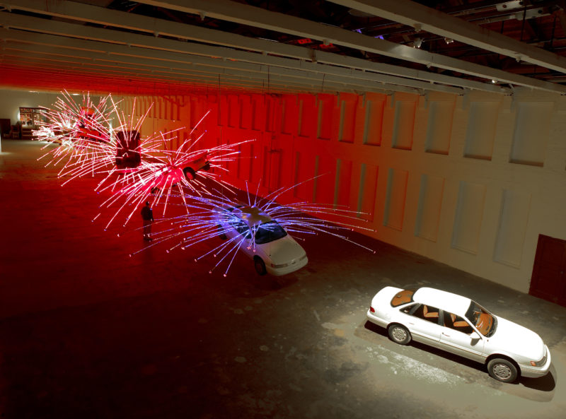 Cai Gao-Qiang – Inopportune Stage One, 2004, nine Ford Taurus cars, sequenced multichannel light tubes, installation view at Mass MoCA, December 1, 2004 – October 30, 2005