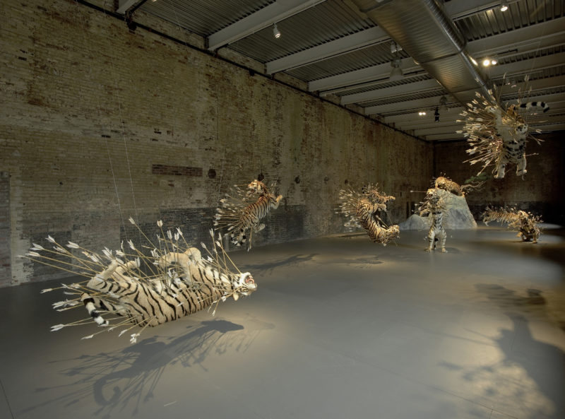 Cai Guo-Qiang – Inopportune Stage One, 2004, nine life-sized tiger replicas, arrows