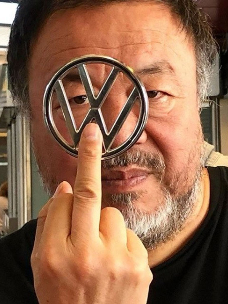 Portrait of Ai Weiwei with Volkswagen logo