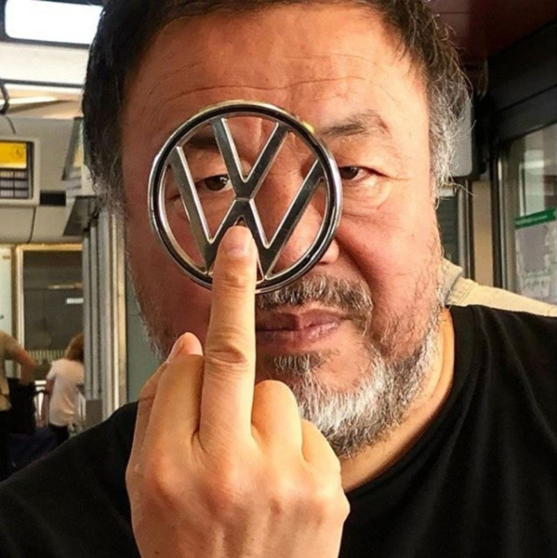 Portrait of Ai Weiwei with Volkswagen logo