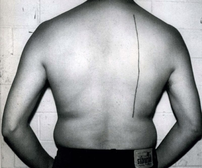Santiago Sierra - Person paid to have a 30 cm line tattooed on them (Línea de 30 cm tatuada sobre una persona remunerada), Regina Street # 51, Mexico City, May 1998