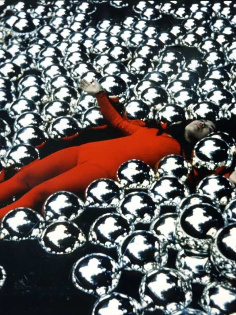 Yayoi Kusama lying in Narcissus Garden, 1966, Venice Biennial