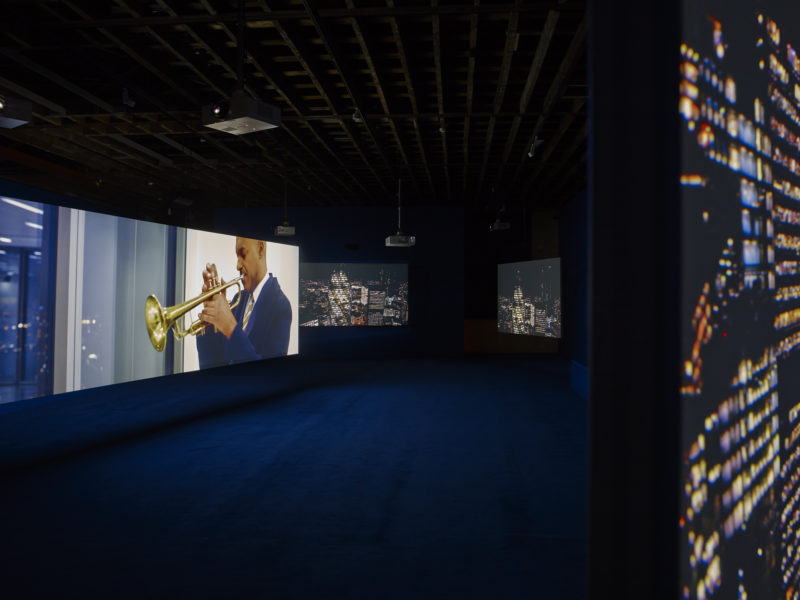 Colin Salmon in Isaac Julien's - Playtime, 2014, Seven screen ultra high definition video installation with 7.1 surround sound, 66 min 57 sec, Victoria Miro, London, 2014