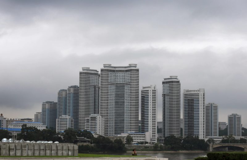 David Guttenfelder - A North Korean soldier stands against a complex of high rise apartment buildings in the Mansudae district downtown Pyongyang on July 21, 2013. The country is preparing to mark the 60th anniversary of the end of the Korean War