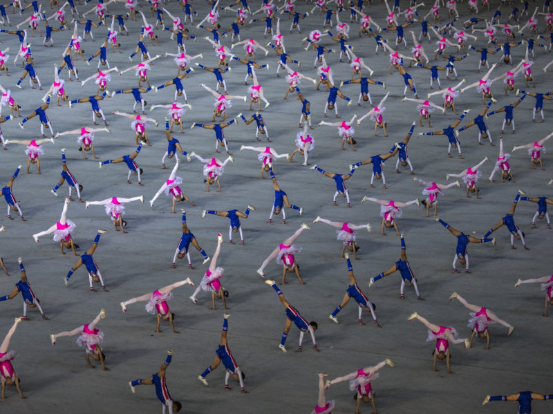 David Guttenfelder - North Korean do cartwheels on the field of the May Day Stadium
