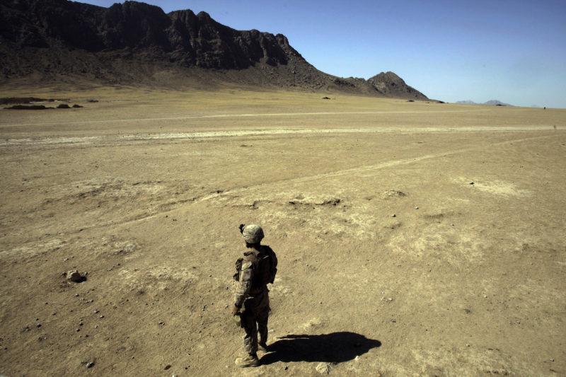 David Guttenfelder – Afghanistan - In Helmand Province, Afghanistan, a US marine surveys the barren landscape during a patrol