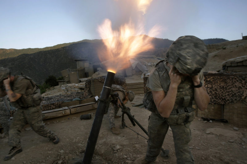 David Guttenfelder – Afghanistan - Soldiers from the U.S. Army First Battalion, 26th Infantry fire mortars from the Korengal Outpost