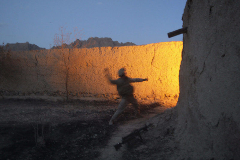 David Guttenfelder – Afghanistan - U.S Marine Daniel Hinther of Helena, Montana, with the 2nd MEB, 2nd Battalion, 3rd Marines throws a hand grenade during close quarter battle with insurgent fighters inside a mud-walled compound near Now Zad in Afghanistan's Helmand province Saturday June 20, 2009.
