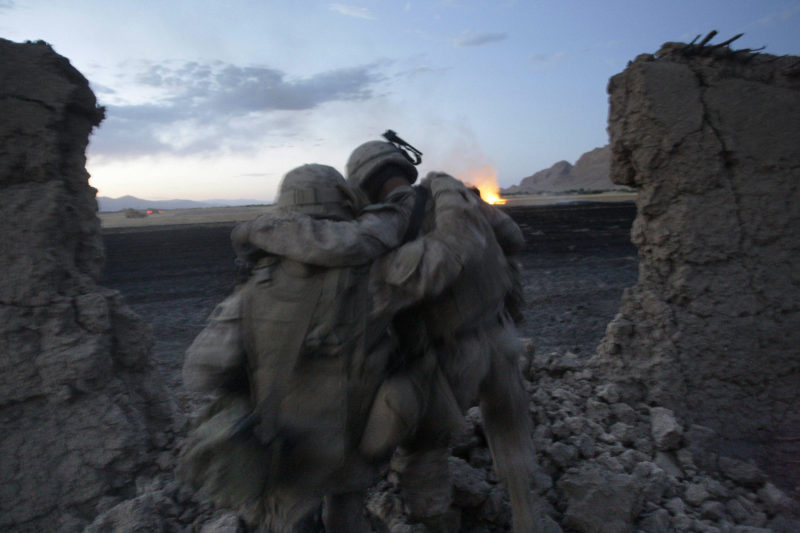 David Guttenfelder – Afghanistan - U.S Marine John Daly, right, of Collingdale, Pa. and from the 2nd MEB, 2nd Battalion, 3rd Marines is helped by a fellow Marine after injuring his ankle in a fall when insurgent fighters opened fire on him and his squad inside a mud walled compound during a gun battle near Now Zad in Afghanistan's Helmand province Saturday June 20, 2009