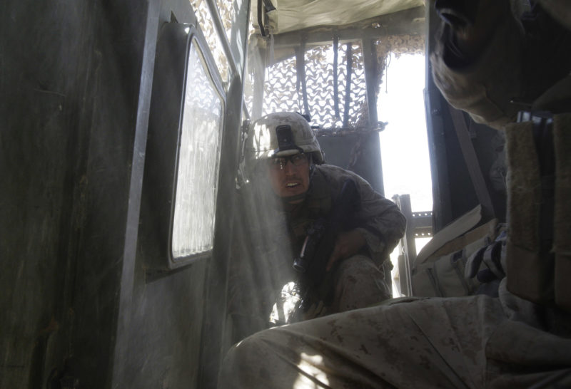 David Guttenfelder – Afghanistan - U.S Marines Staff Sgt. Luke Medlin of Indiana and from the 2nd MEB, 2nd Battalion, 3rd Marines takes cover as a mortar fired by insurgent fighters explodes next to his vehicle near Now Zad in Afghanistan's Helmand province Saturday, June 20, 2009.