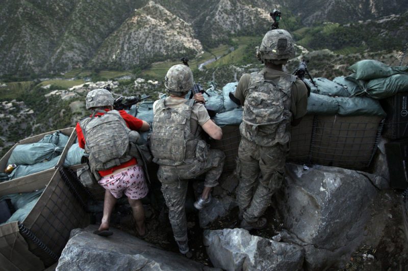 David Guttenfelder – Afghanistan - US Army soldiers take defensive positions and return fire against insurgents behind a rocky cliff in the Korengal Valley of Afghanistan's Kunar Province.
