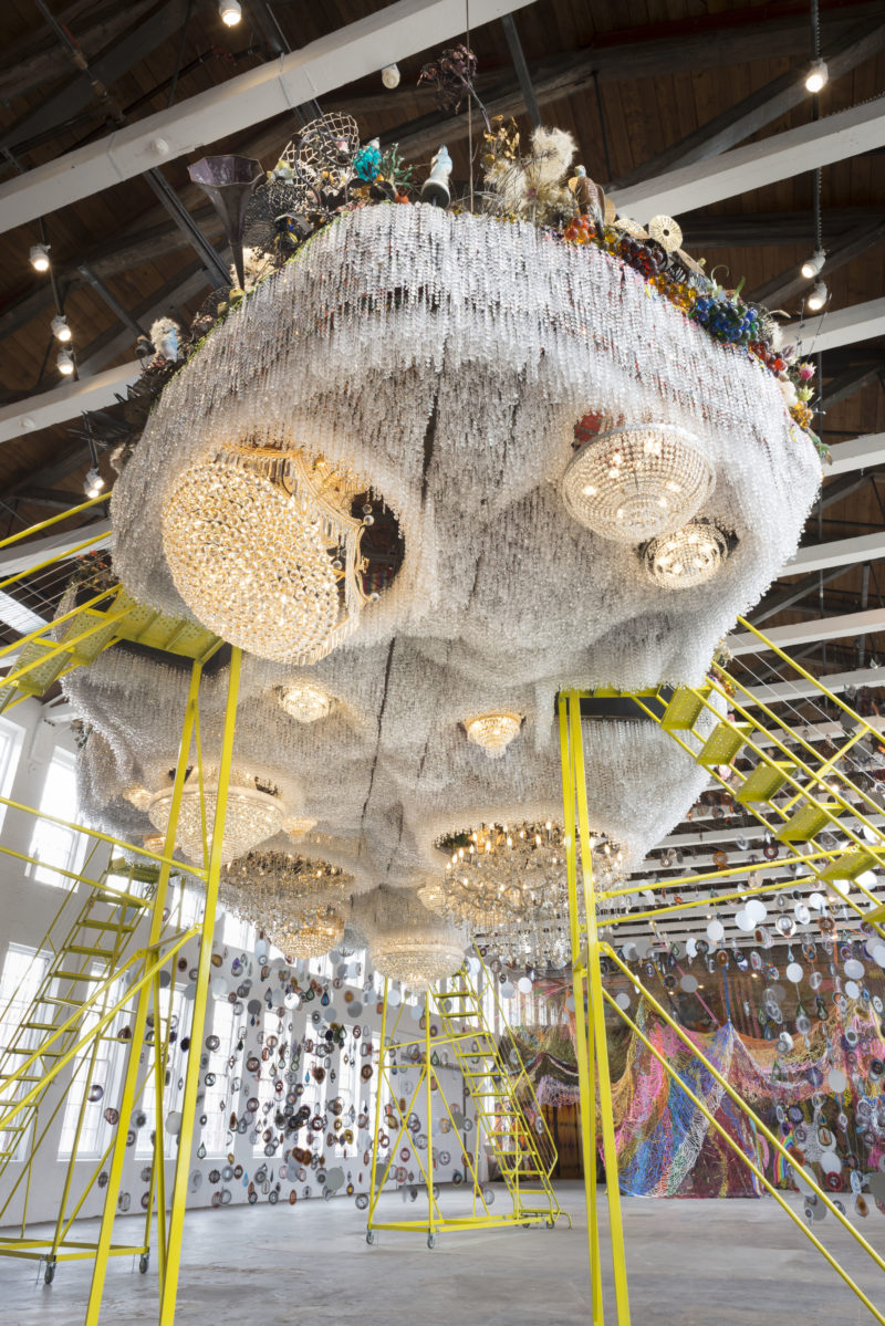 Nick Cave - Crystal Cloudscape, thousands of crystals, beads, found objects and a few chandeliers, 12m long, 6m wide, with four ladders to view artwork from top level, MASS MoCA, 15 Oct 2016 - 4 Sep 2017