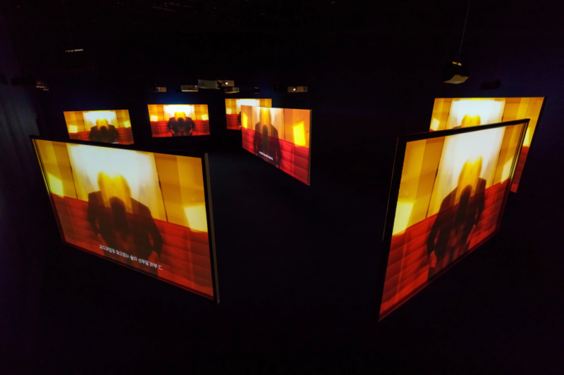 Simon de Pury in Isaac Julien's Playtime, 2014, Seven screen ultra high definition video installation with 7.1 surround sound, 66 min 57 sec, Platform-L Contemporary Art Center, Seoul, 2017